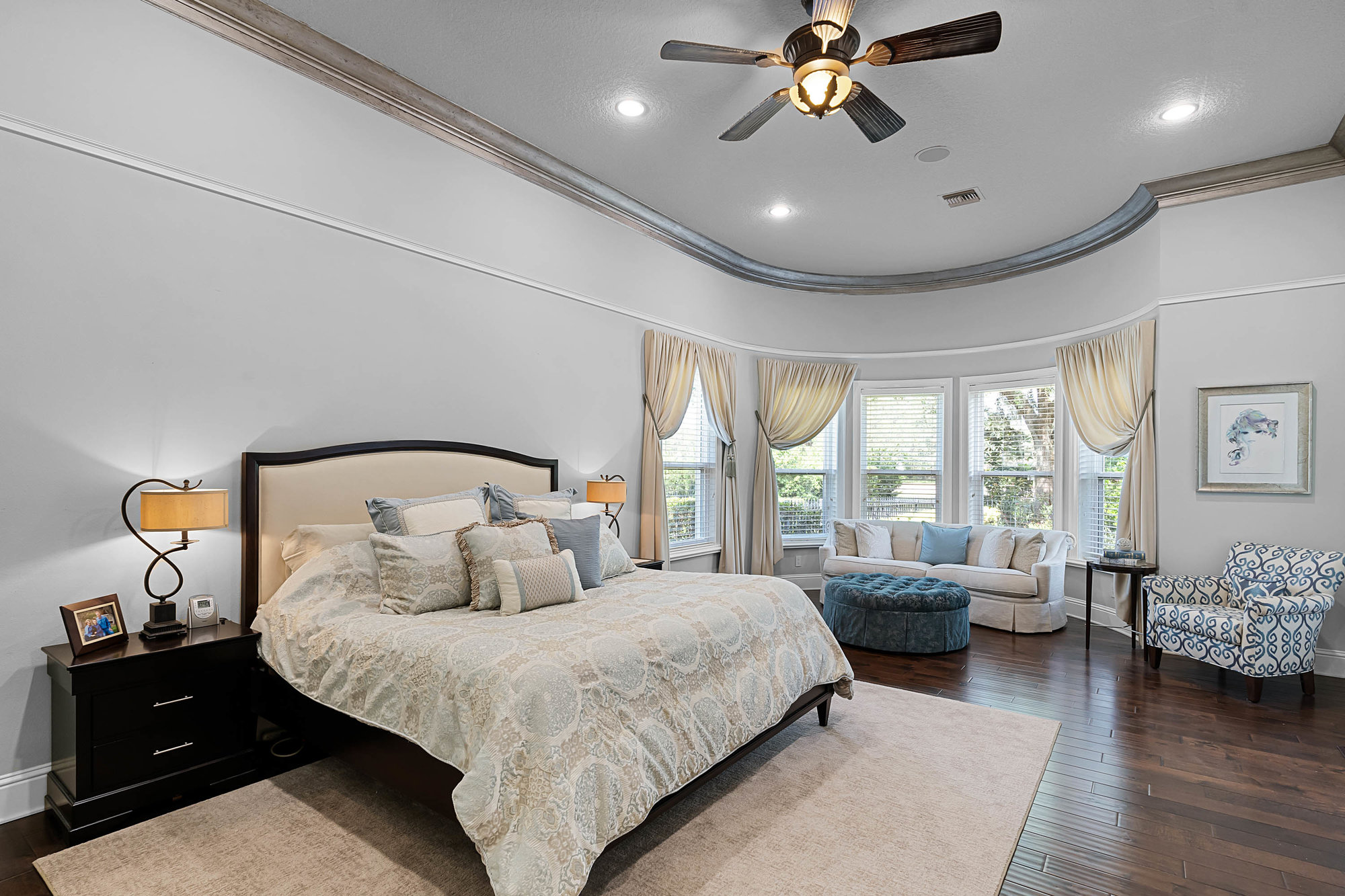 master bedroom with luxury bed and sitting window